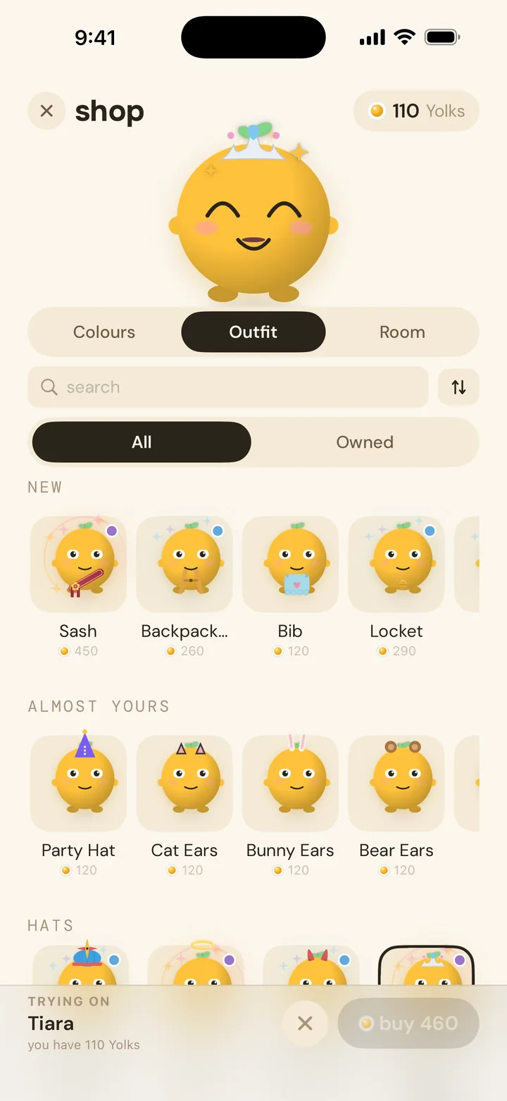 the shop's outfit tab, trying a tiara on before buying it with yolks